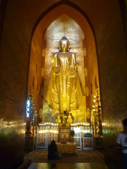 Huge golden standing buddha